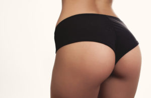 closeup woman beautiful buttocks over white background